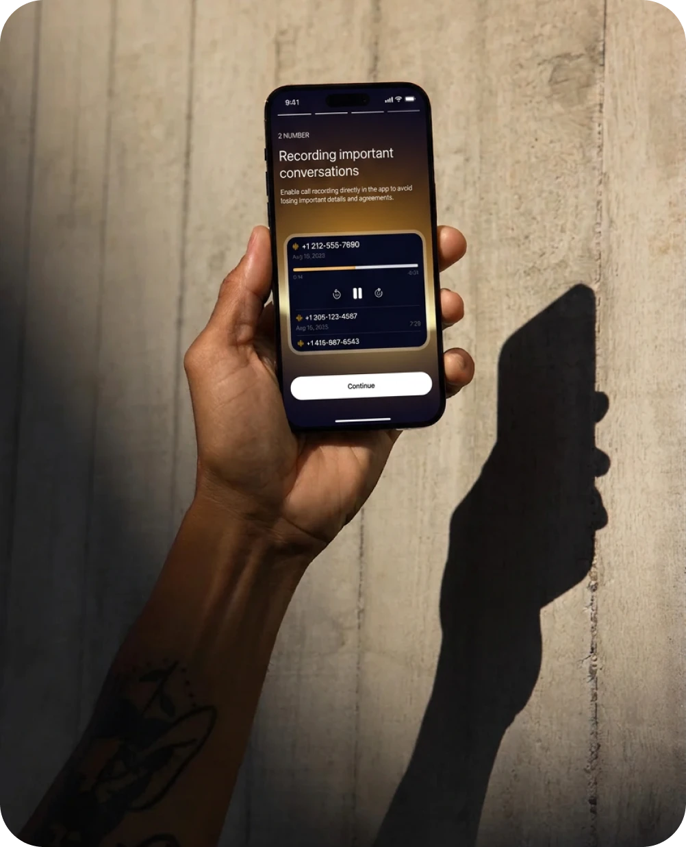 Hand holding a phone with the 2number call recording screen