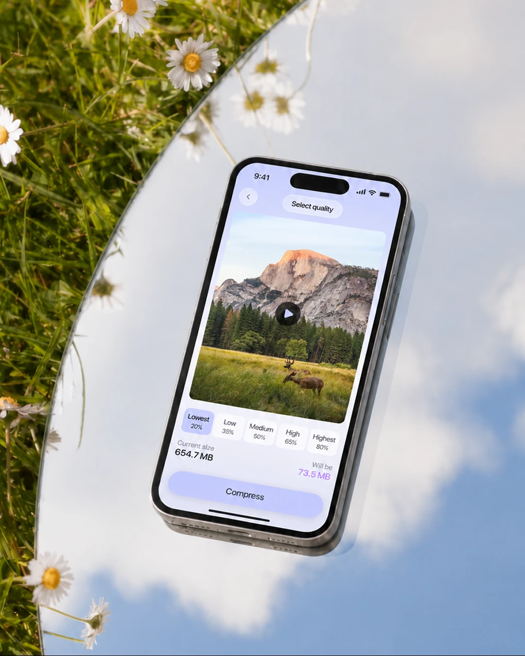 Master Swiper video compression screen on a phone lying on a mirror with daisies